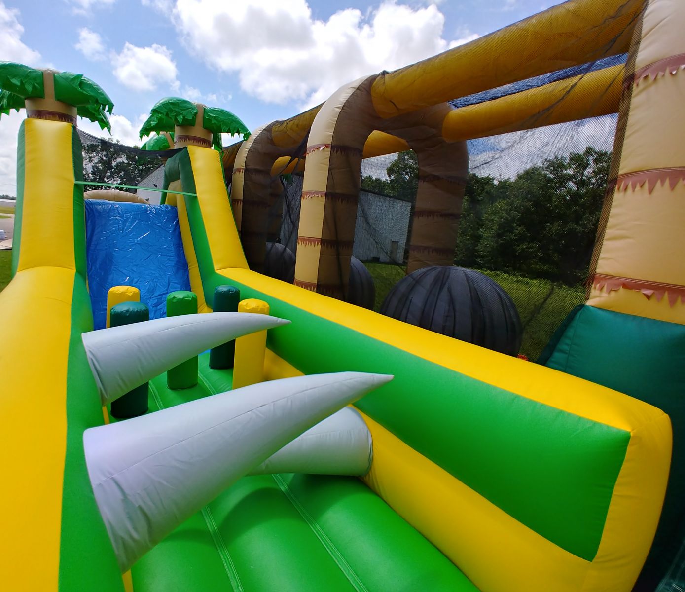 Obstacle course slide and inflatable challenges